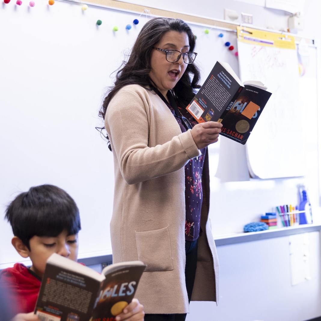 Raquel Hermosillo reads to her class